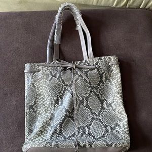 Brand New Banana Republic portfolio  tote with unwrapped smart phone charger.